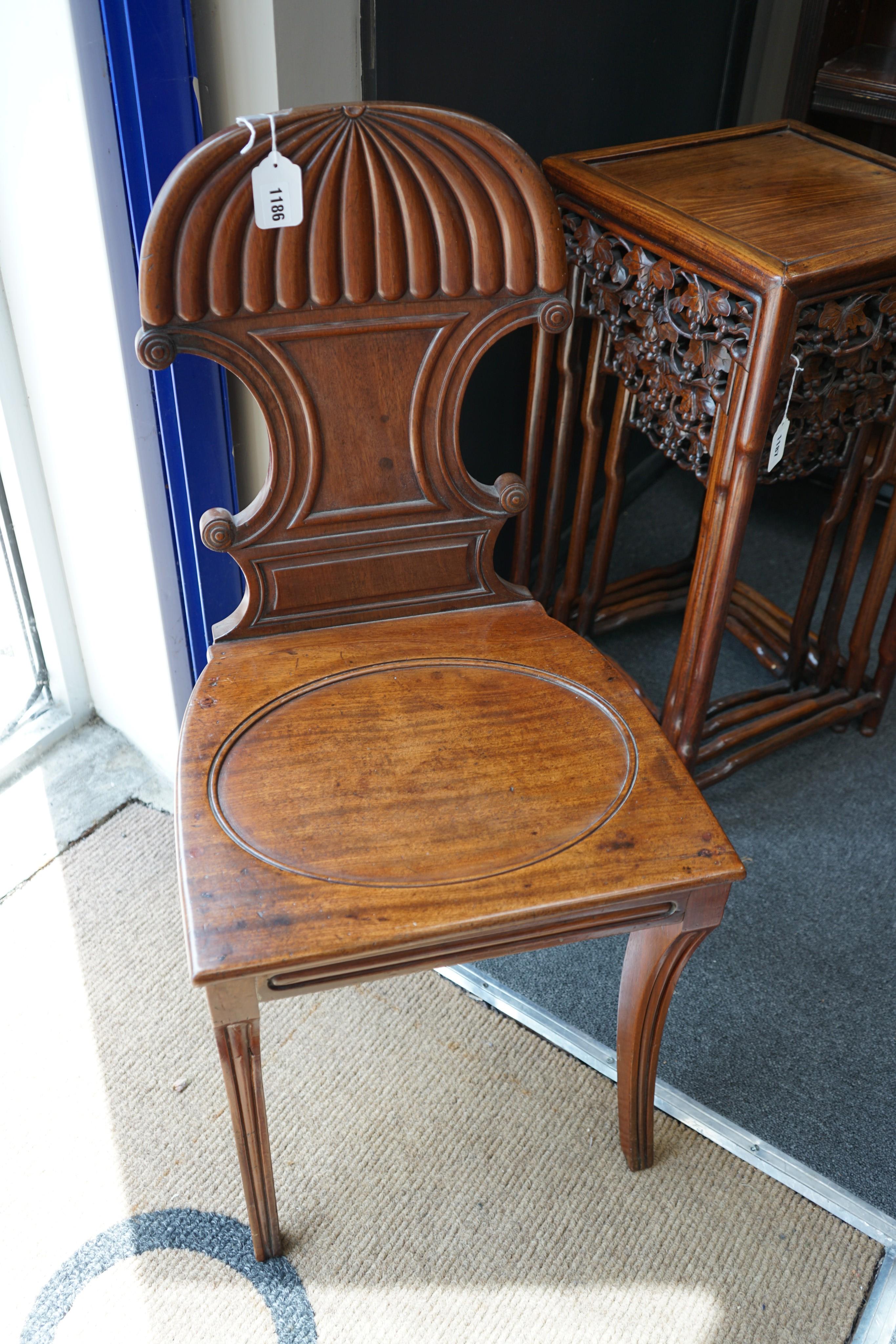 A pair of Regency mahogany hall chairs, width 42cm, depth 39cm, height 89cm